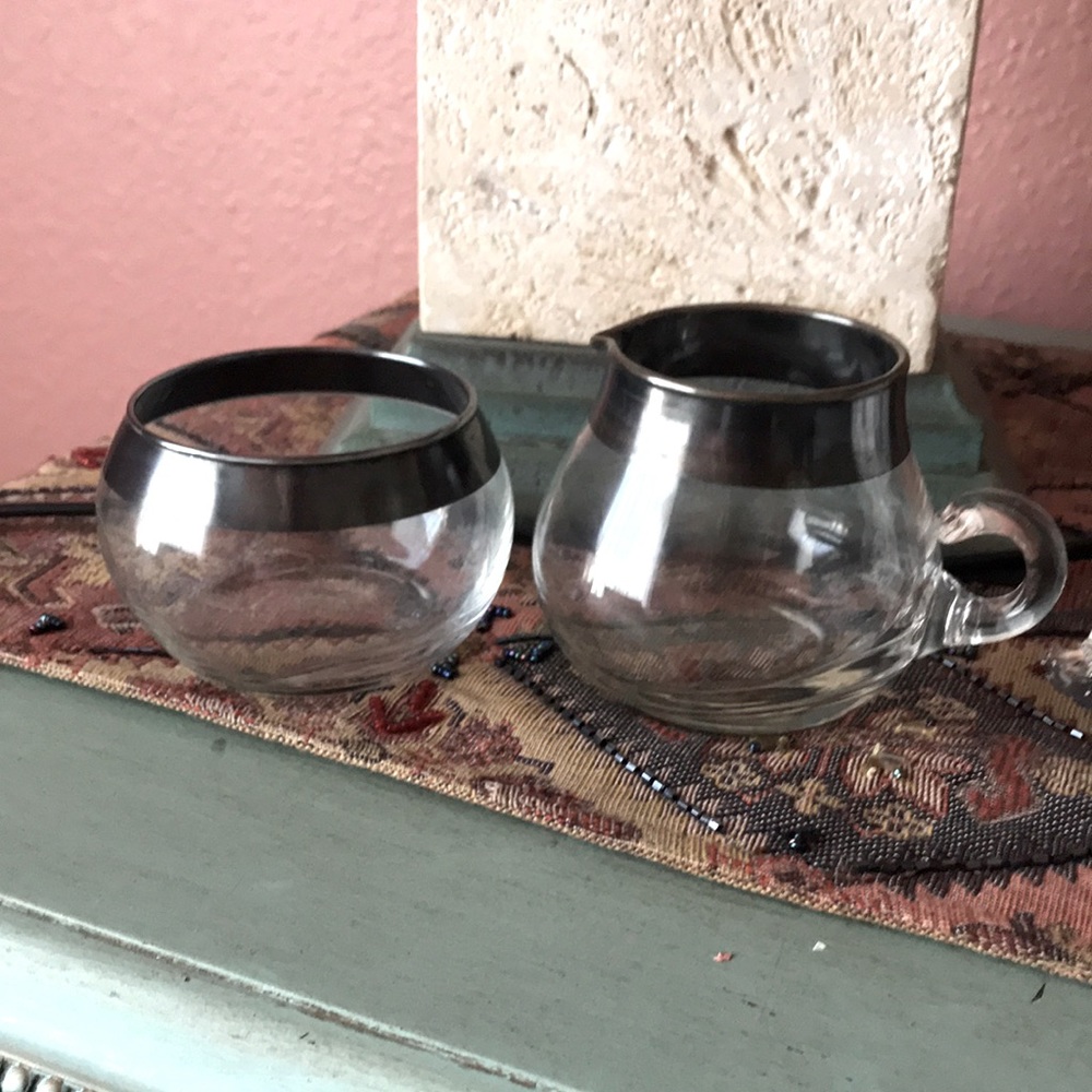 Silver plated rim glass creamer and sugar bowl. Great condition